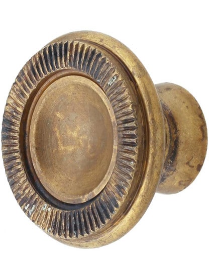 Knurled Edge Cabinet Knob - 1.18 inch Diameter in Antique Brass Distressed.